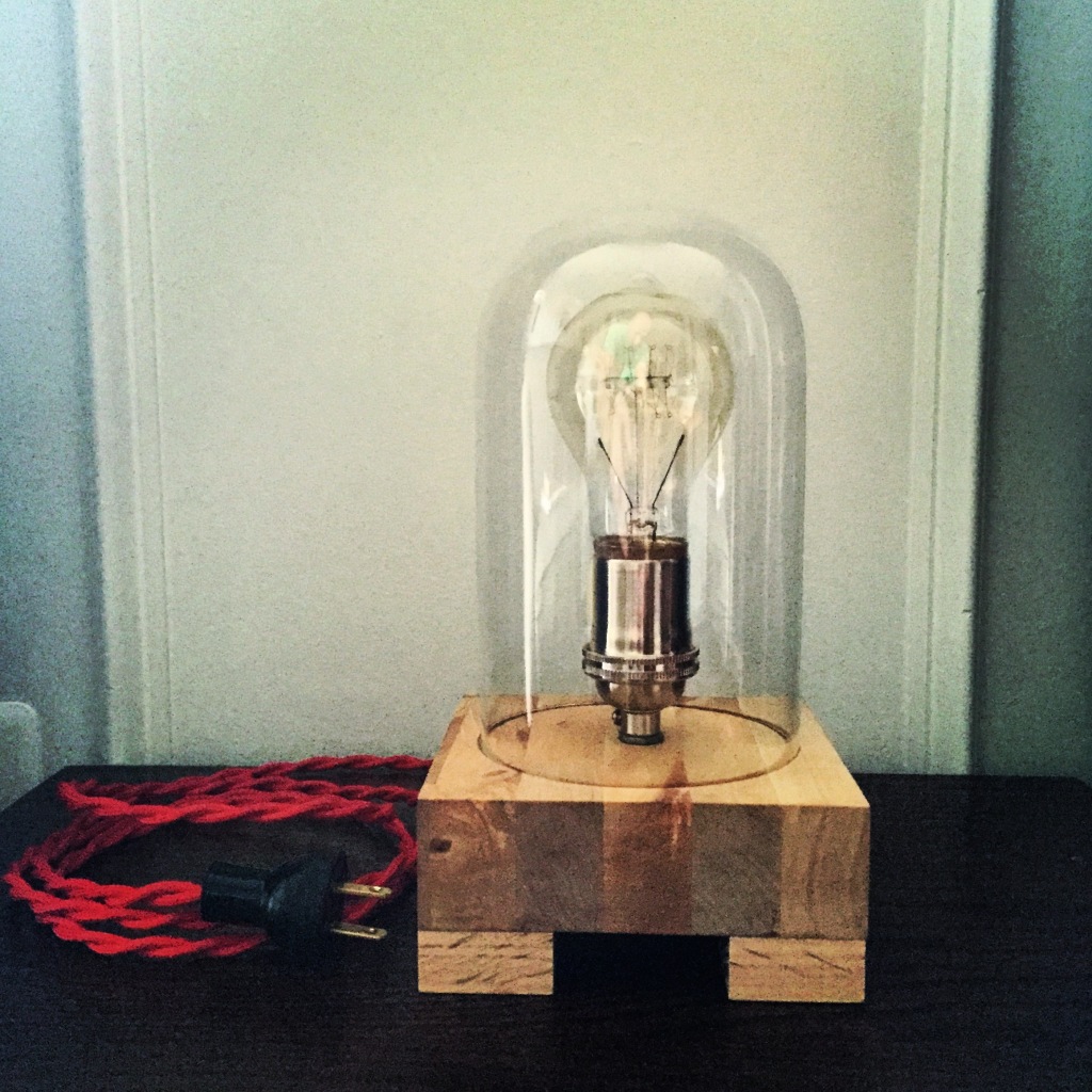 Sample table lamp from our new line of lighting. Recycled butcher block base with vintage-style red cord.
